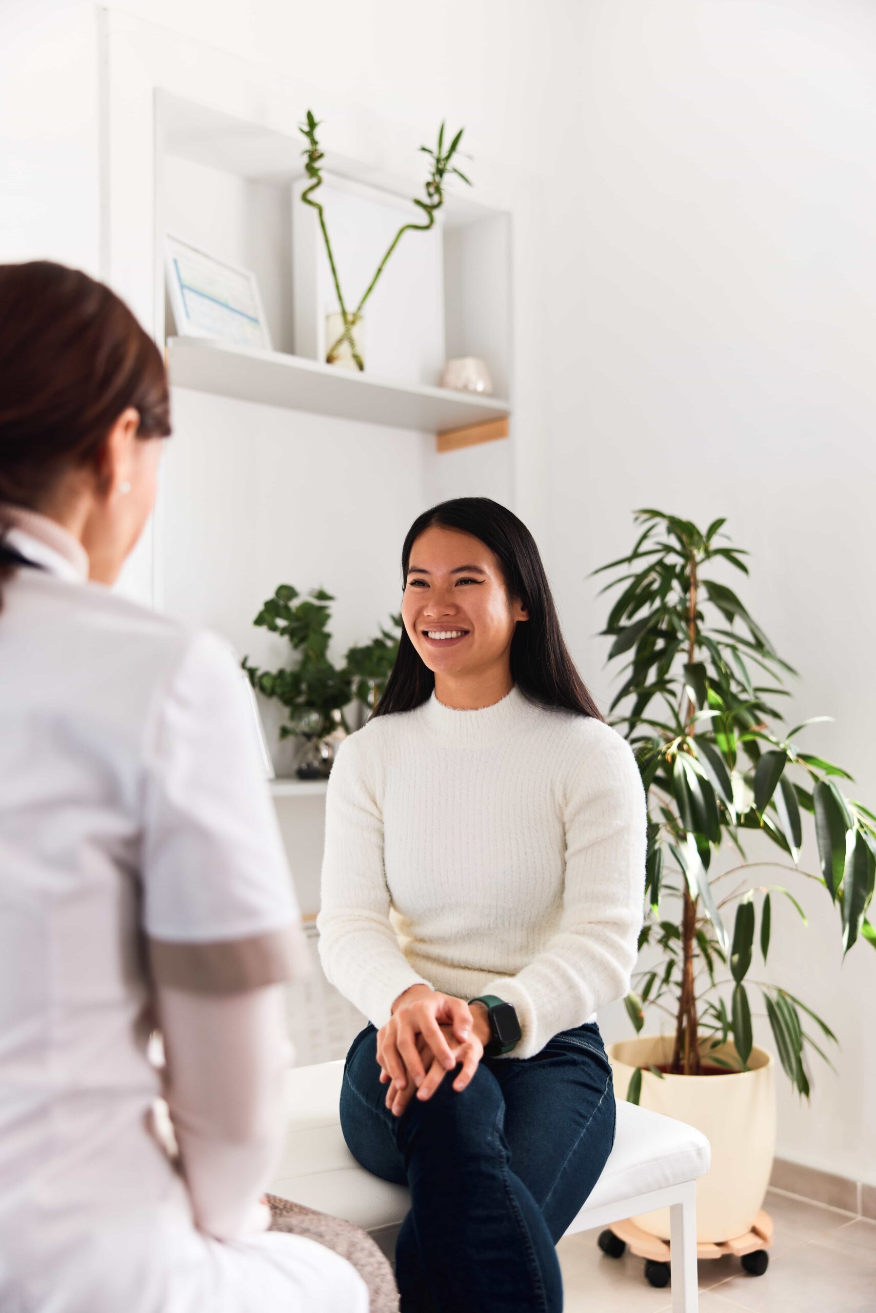 a satisfied and healthy asian female patient
