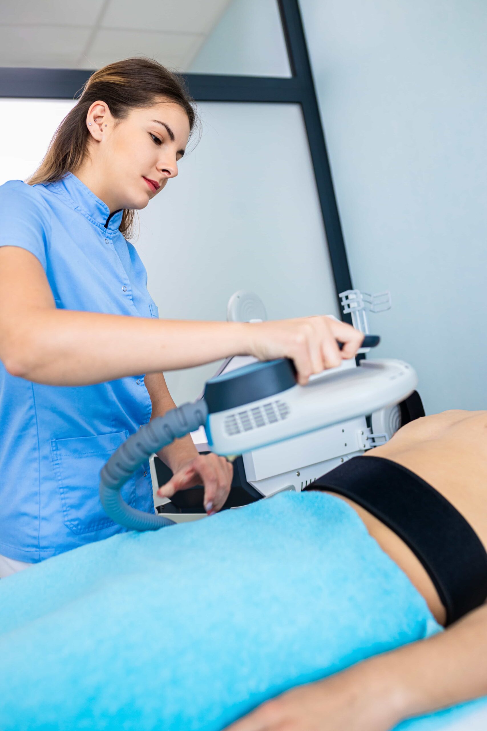 beautician therapist applying burn fat and build