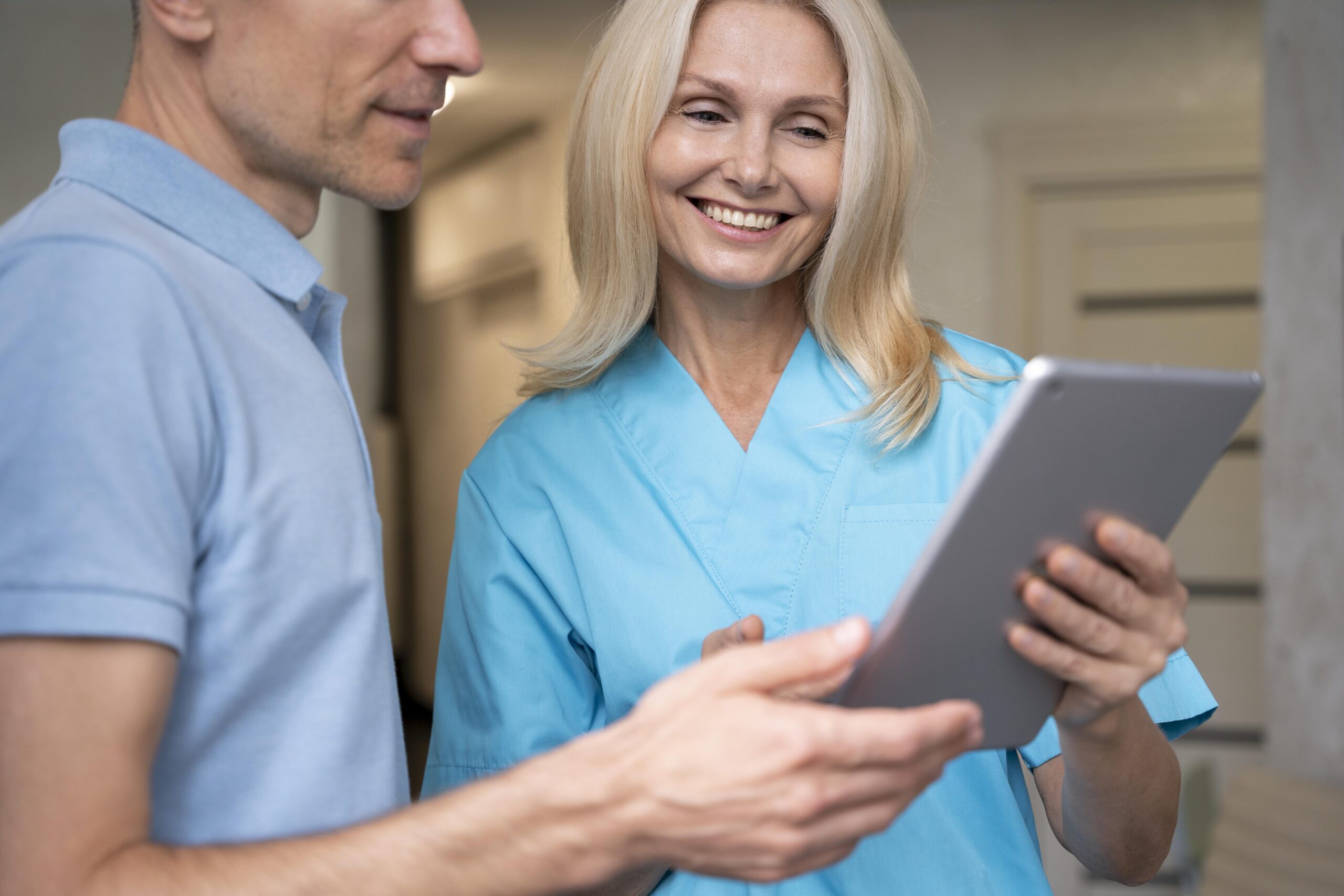 Doctor Discussing Treatment with Client using ipad