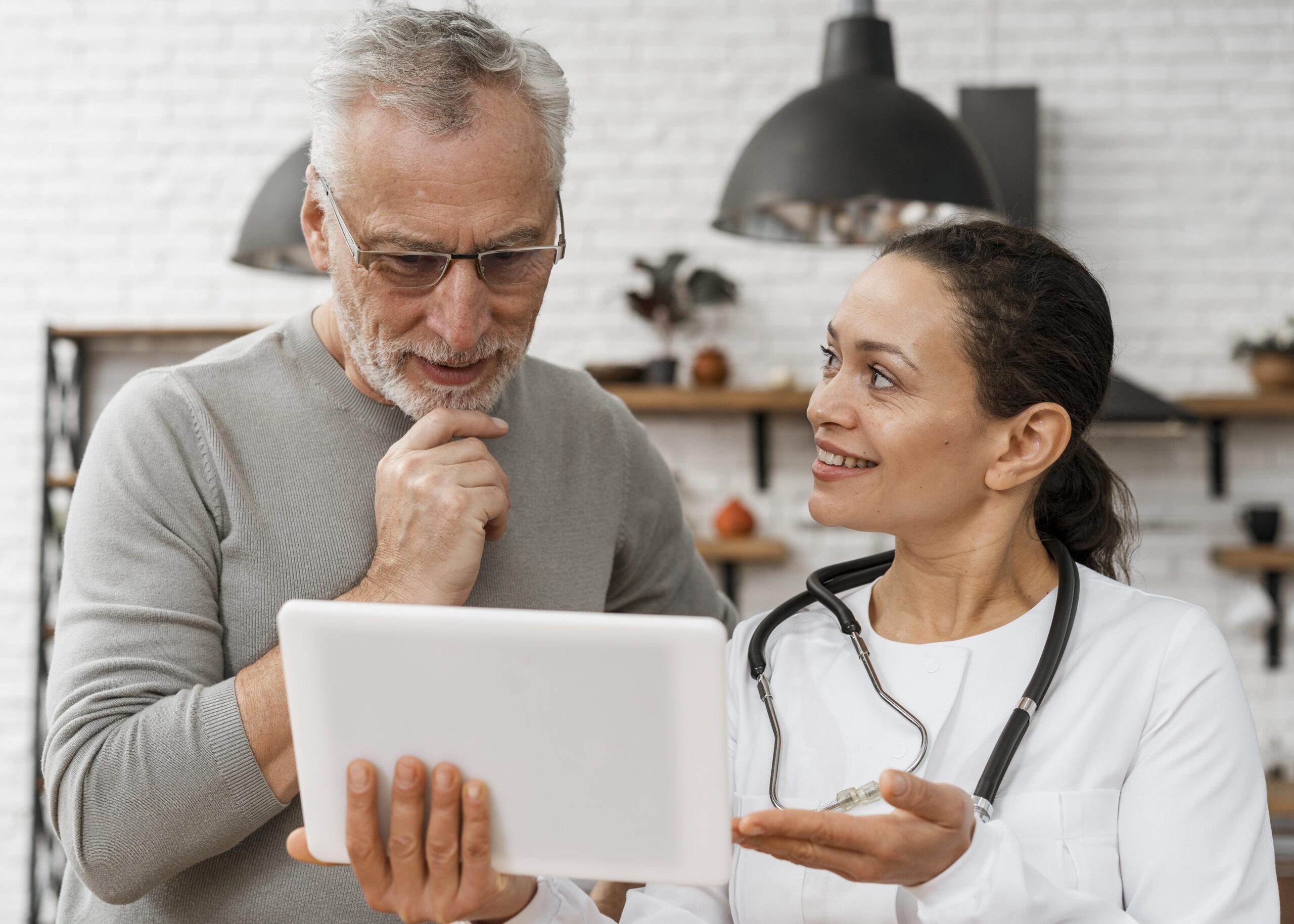 Patient reading health data from tablet device