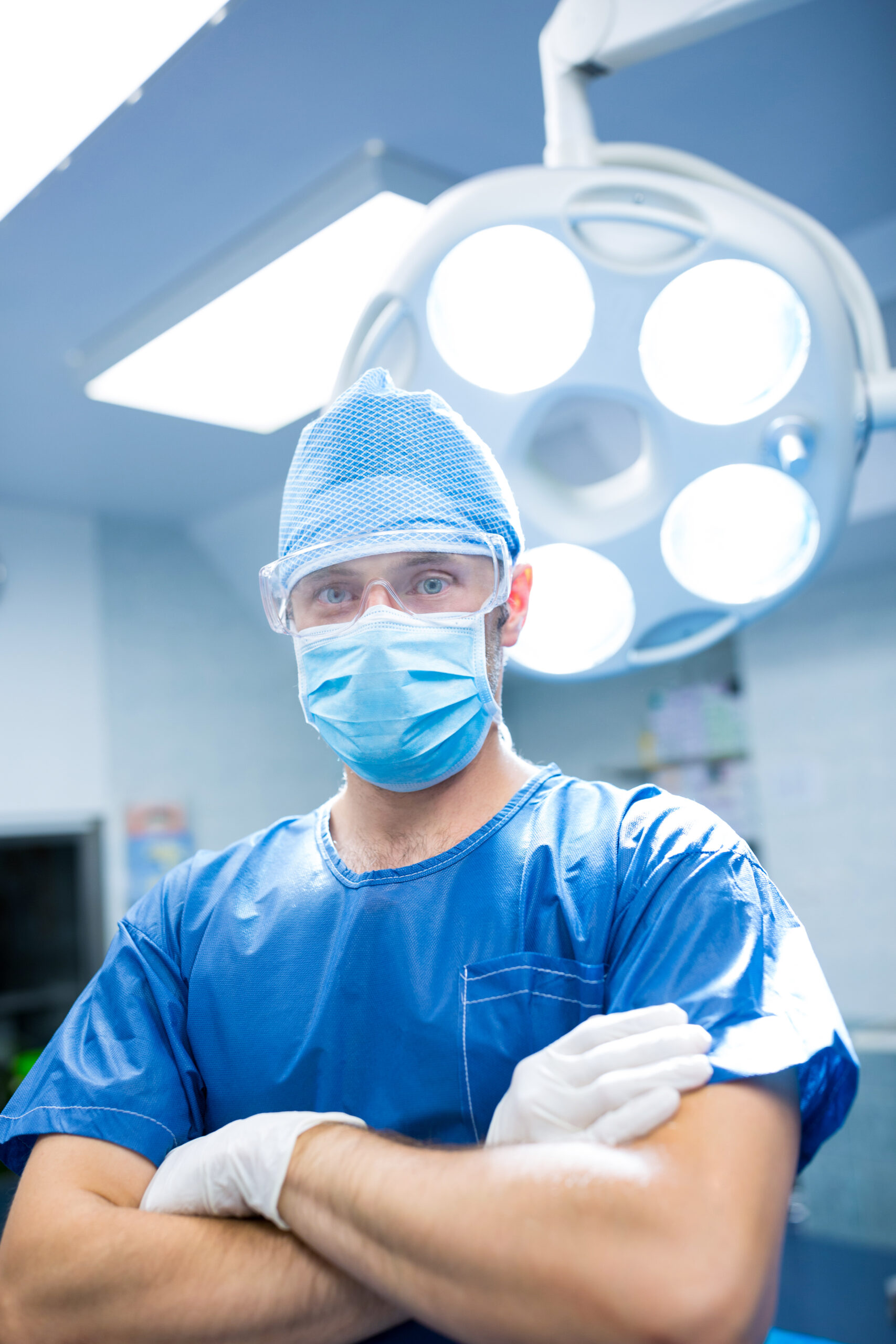 Surgeon crossed arms with mask on