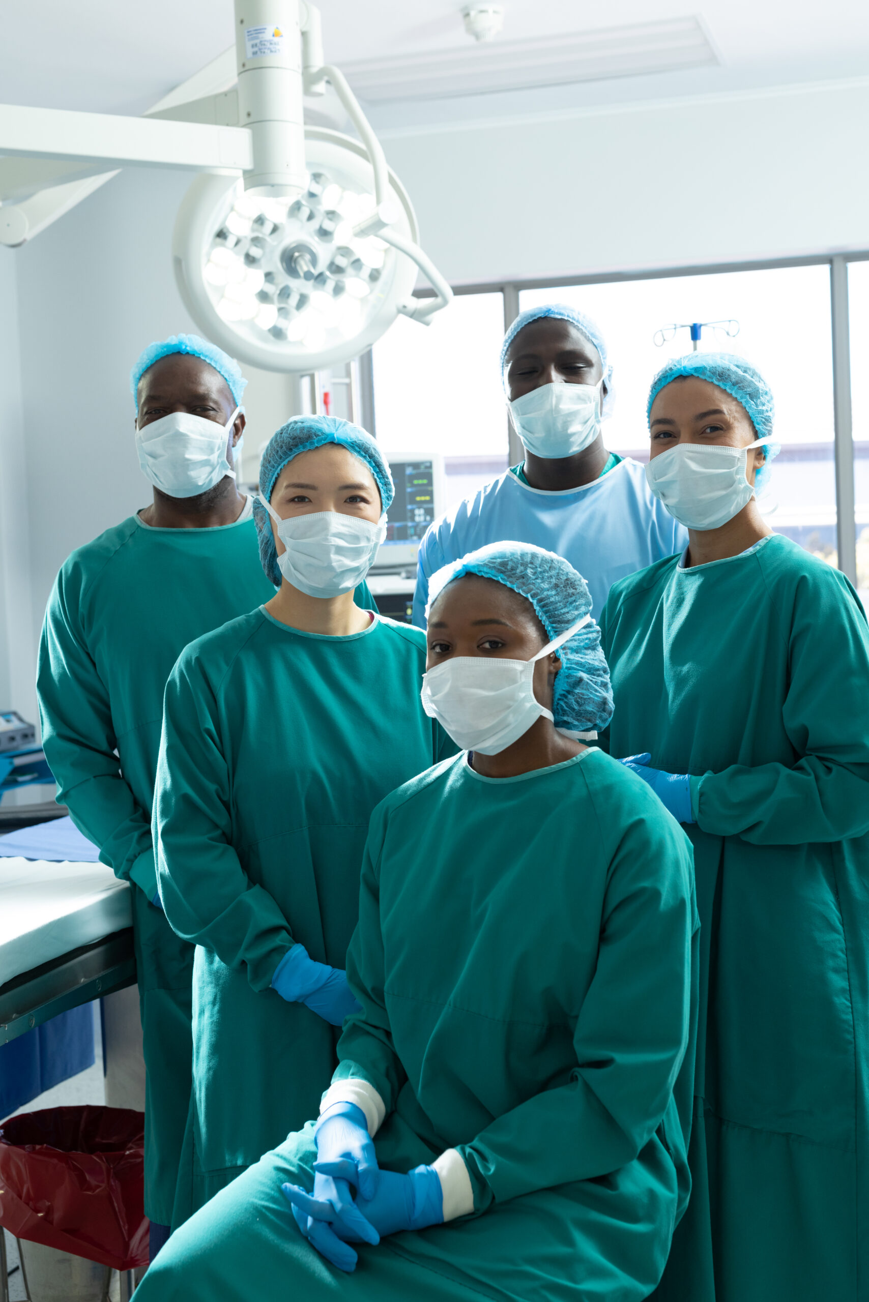 5 Doctors smiling at the camera