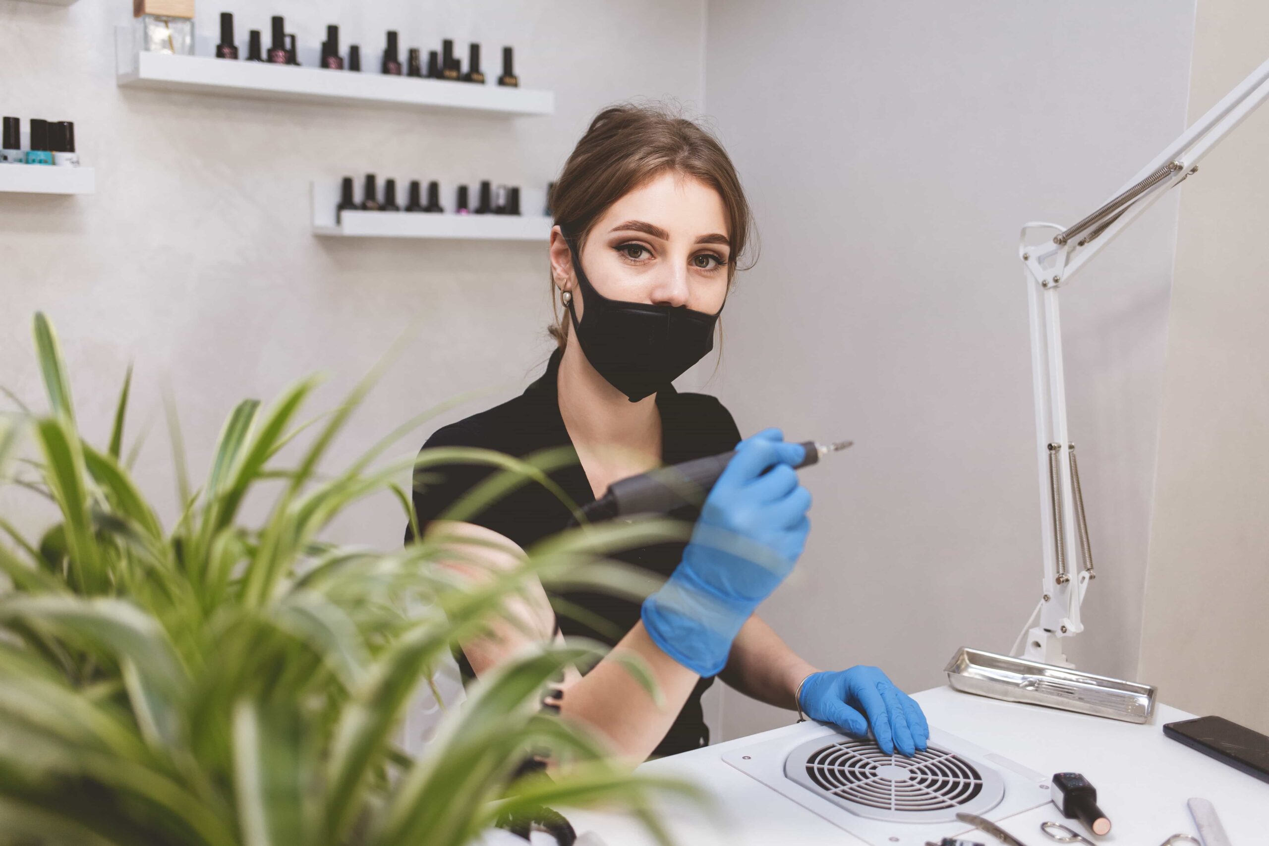 young beautiful manicurist waiting for clients