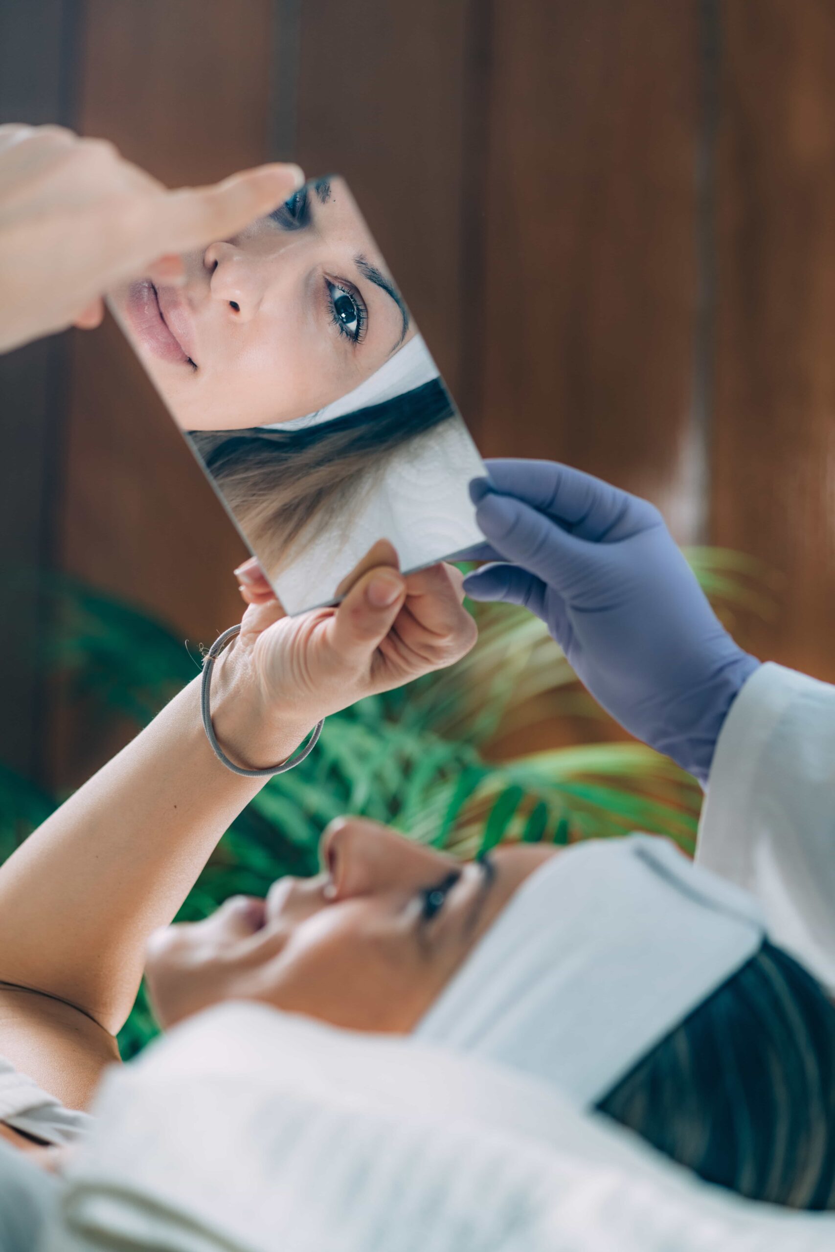 Client reviewing Facial beauty after receiving treatment 
