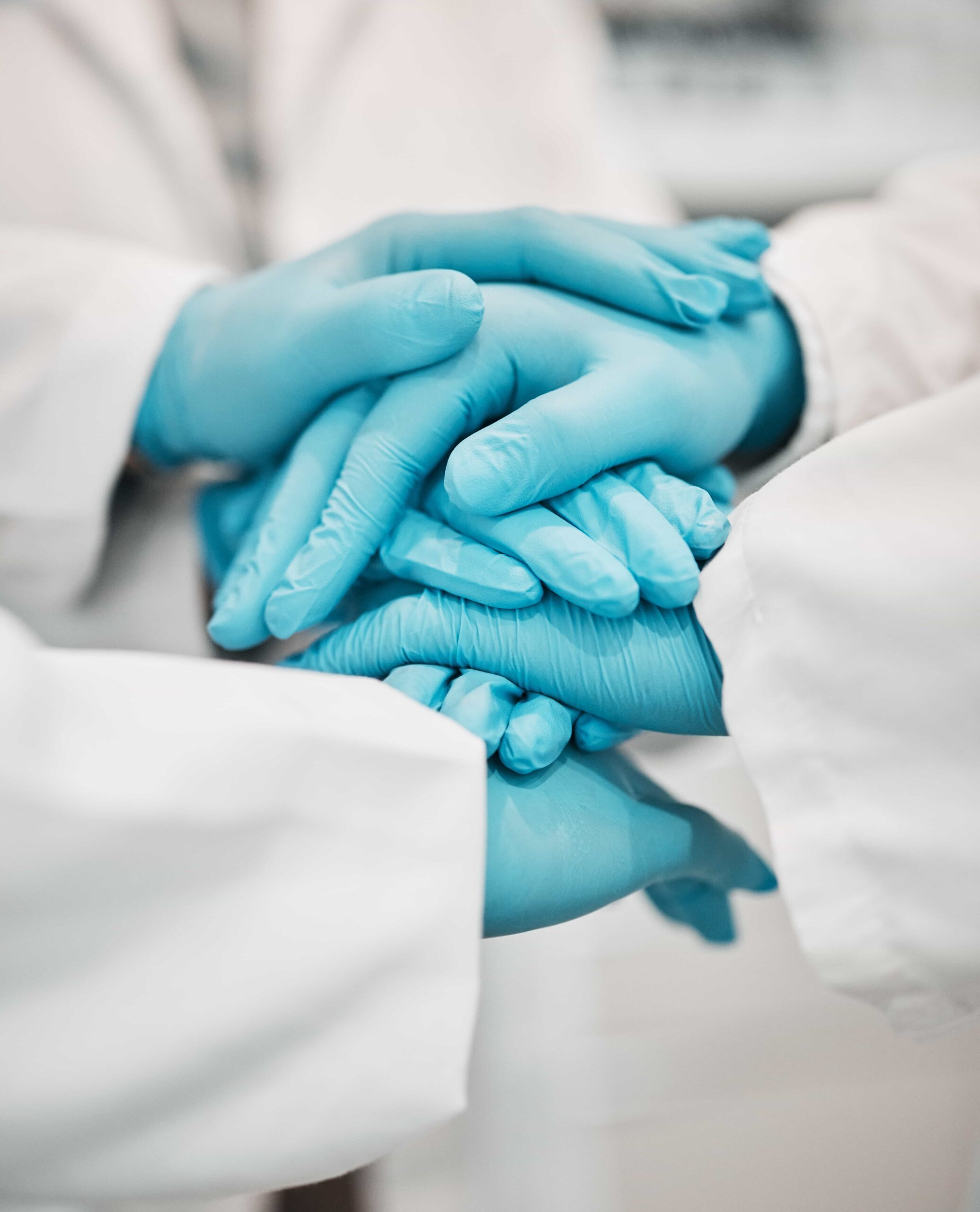 Female medical professional comforting female patient.