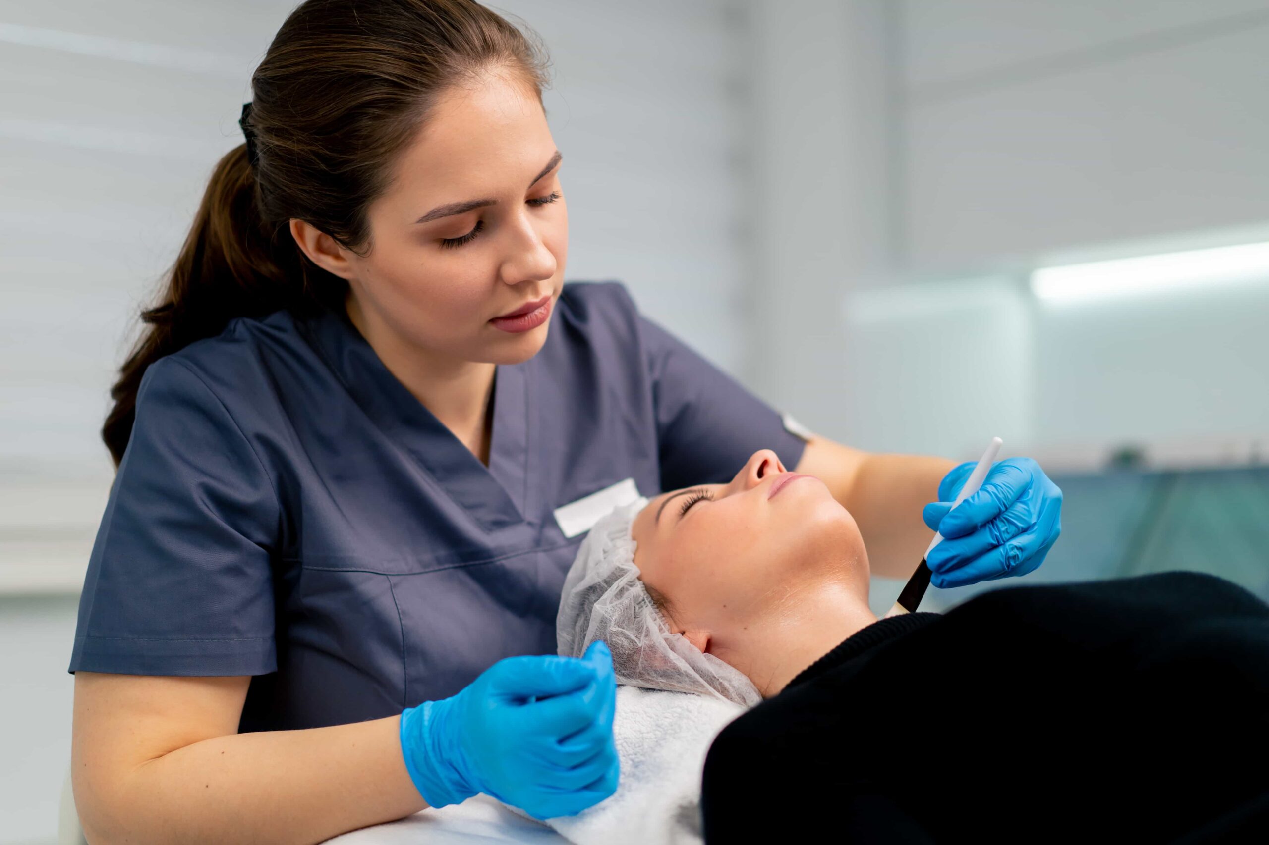 Image showing woman conducting procedure under training. 